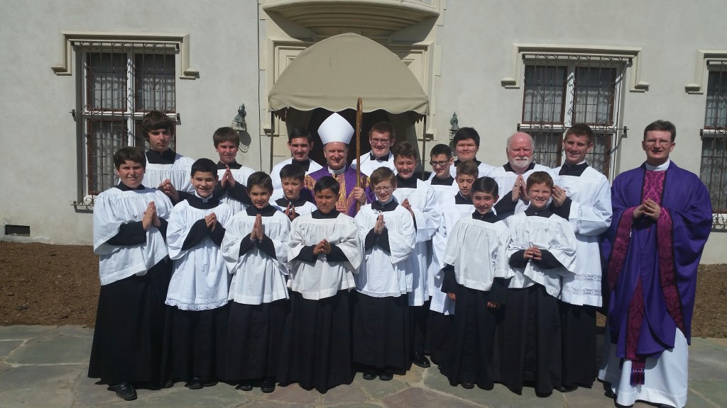 Altar servers pictured with His Excellency Bishop Michael C. Barber (center) and Rev. Rafal Duda (right) after the Confirmation Mass in March 2015. Photo credit Rev. Alex Castillo